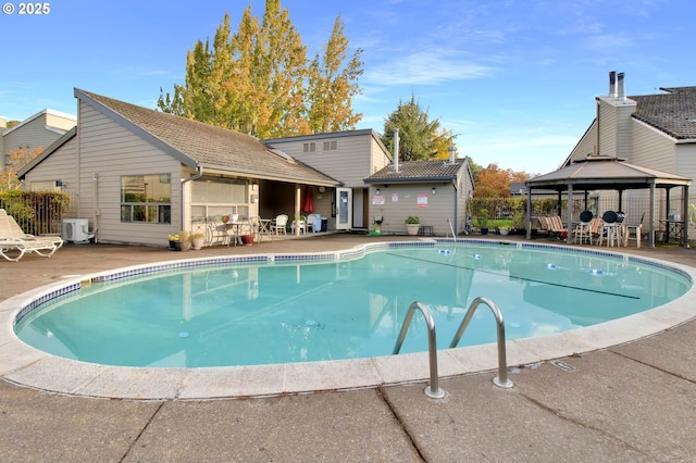 2062 Lake Isle Dr, Eugene, OR 97401 - community pool with a gazebo, a patio, and a cooling unit