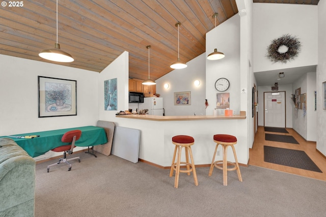 2062 Lake Isle Dr, Eugene, OR 97401 - kitchen featuring freestanding refrigerator, carpet flooring, black microwave, wooden ceiling, and high vaulted ceiling