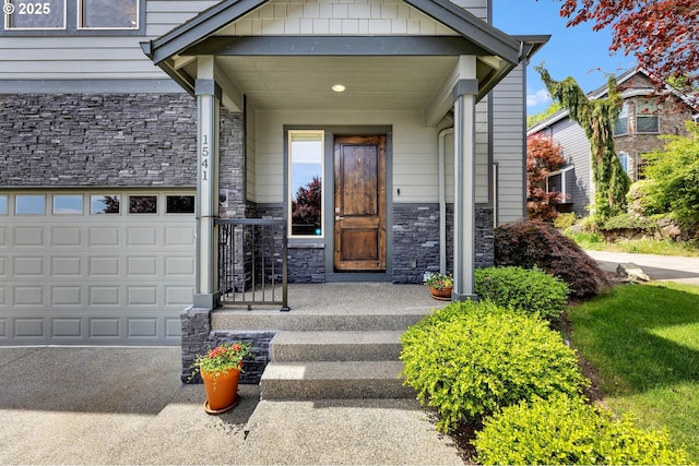 property entrance featuring stone siding and a garage