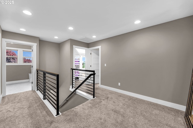 stairway featuring carpet floors, baseboards, and recessed lighting