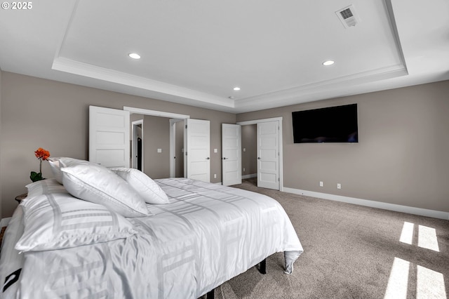 carpeted bedroom featuring a tray ceiling, recessed lighting, and baseboards