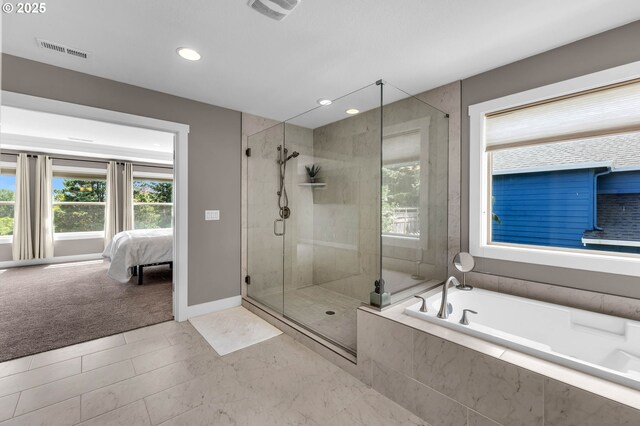 full bath with a stall shower, a garden tub, ensuite bathroom, recessed lighting, and baseboards
