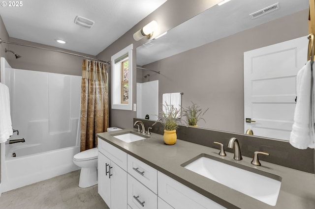 bathroom with shower / bath combination with curtain, toilet, and double vanity