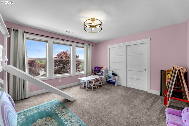 rec room with carpet floors and baseboards