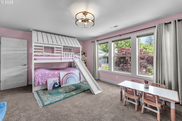 carpeted bedroom featuring baseboards