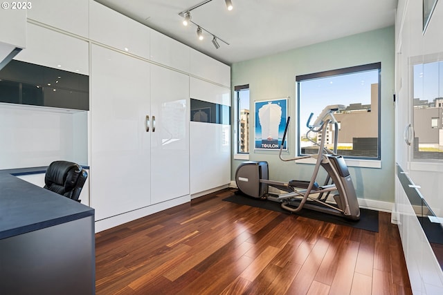 office area featuring dark wood finished floors and baseboards