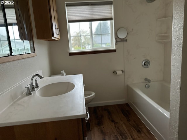 full bathroom featuring hardwood / wood-style floors, vanity, toilet, and shower / washtub combination