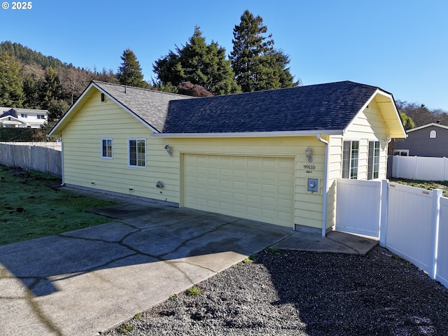 view of side of home with a garage