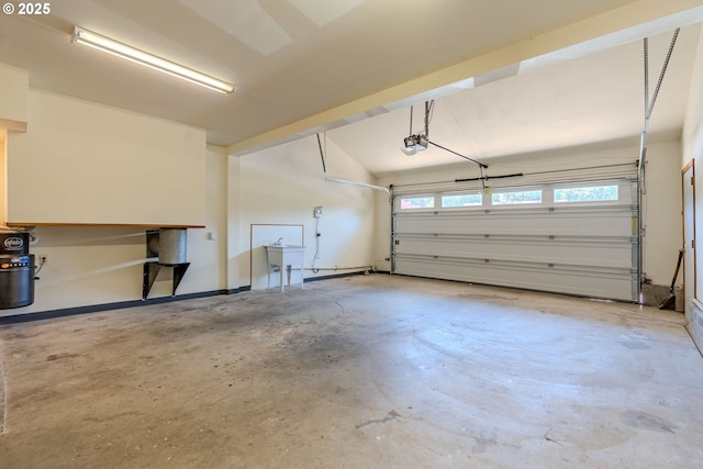 975 SW Florence Ct, Gresham, OR 97080 - garage featuring a garage door opener and a sink