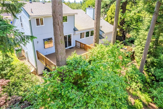 975 SW Florence Ct, Gresham, OR 97080 - rear view of property featuring roof with shingles, a wooden deck, and a chimney