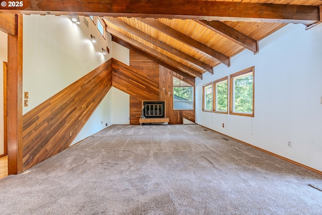 975 SW Florence Ct, Gresham, OR 97080 - unfurnished living room featuring wood ceiling, carpet floors, a large fireplace, and wooden walls