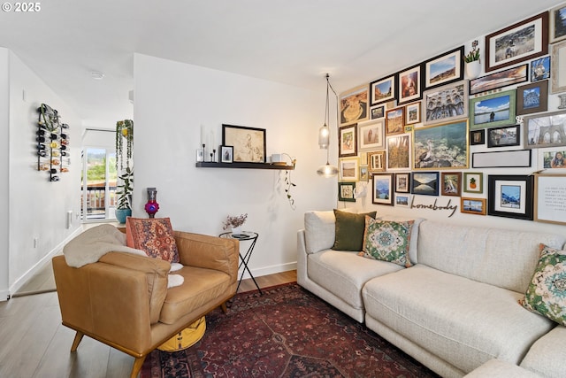 living room with wood finished floors and baseboards