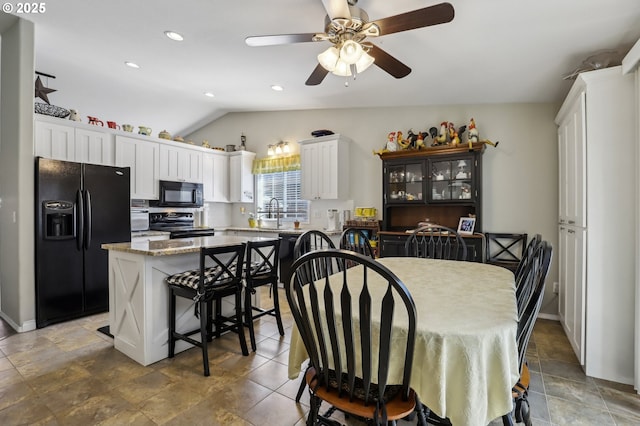 dining space featuring lofted ceiling, baseboards, a ceiling fan, and recessed lighting