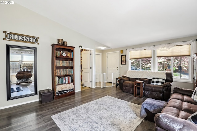 living room with lofted ceiling, baseboards, and dark wood-style floors