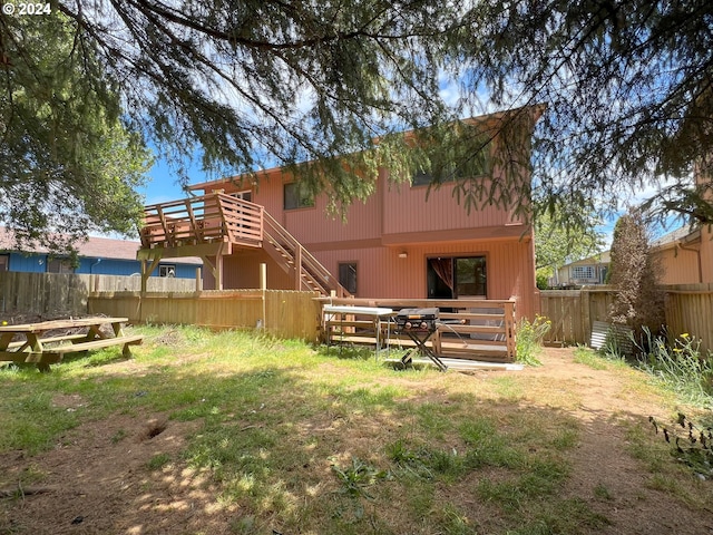 back of house with stairs