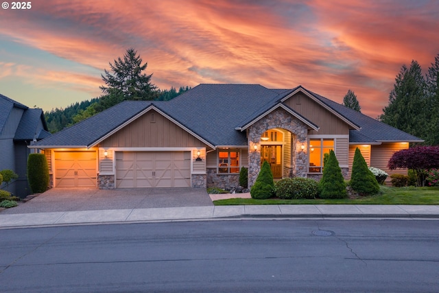 4644 SE Honors Dr, Gresham, OR 97080 - craftsman house featuring stone siding, a garage, driveway, and board and batten siding