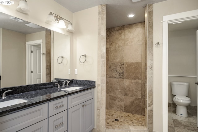 1516 Samuel Dr, Cottage Grove, OR 97424 - bathroom featuring a walk in shower, toilet, double vanity, and recessed lighting