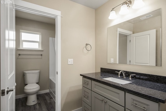 1516 Samuel Dr, Cottage Grove, OR 97424 - bathroom with toilet, vanity, wood finished floors, and baseboards