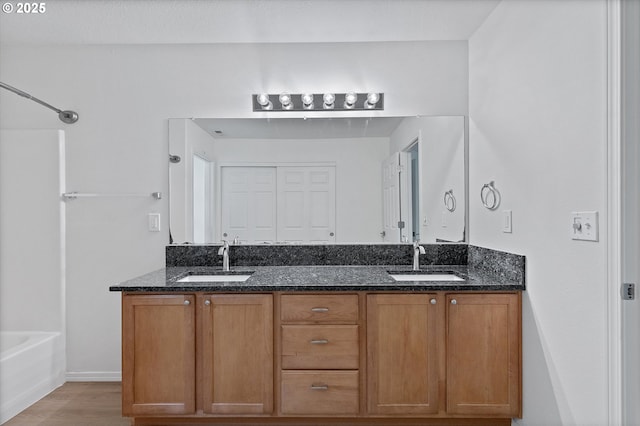 bathroom with vanity and hardwood / wood-style flooring