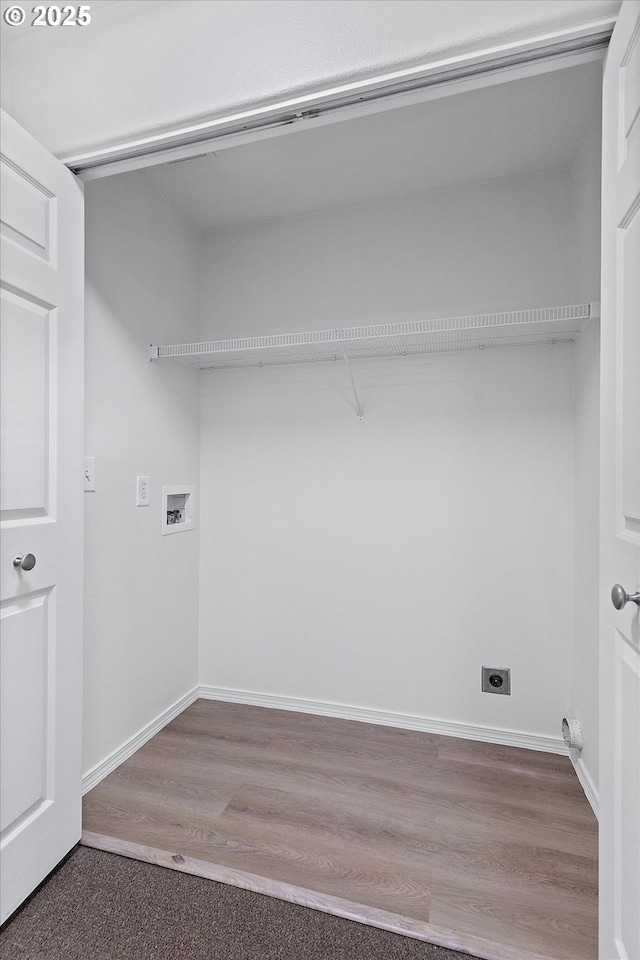 washroom featuring hookup for an electric dryer, washer hookup, and hardwood / wood-style floors