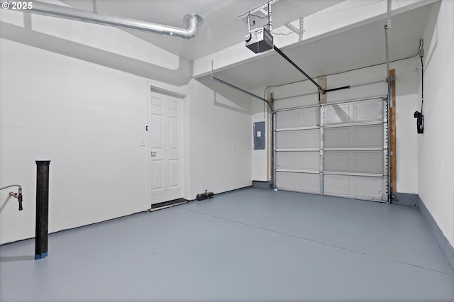 garage with electric panel and a garage door opener