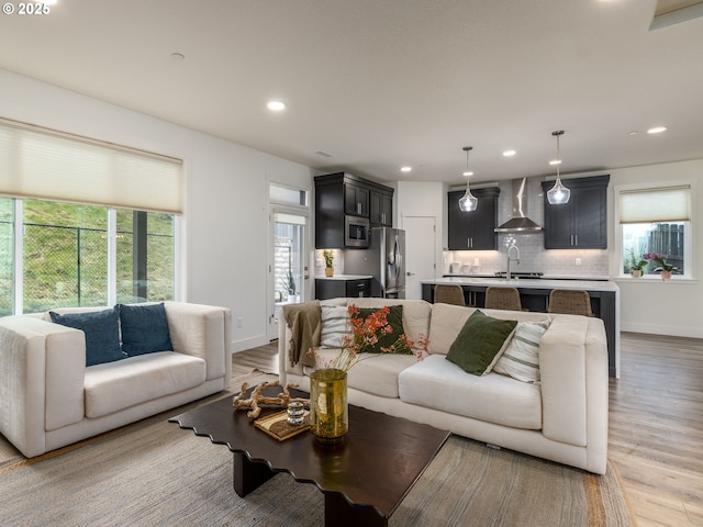 292 W Maple St, Washougal, WA 98671 - living area featuring light wood finished floors, recessed lighting, and baseboards