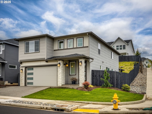 292 W Maple St, Washougal, WA 98671 - view of front of home with driveway, an attached garage, and stone siding