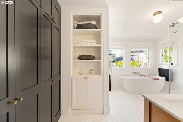 7985 SW Maple Dr, Portland, OR 97225 - full bath with a freestanding tub, a shower, vaulted ceiling, and tile patterned flooring