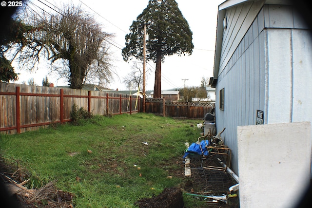 view of yard with a fenced backyard