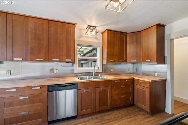 512 Evergreen Dr, Tillamook, OR 97141 - kitchen with stainless steel dishwasher, butcher block counters, a sink, and brown cabinets