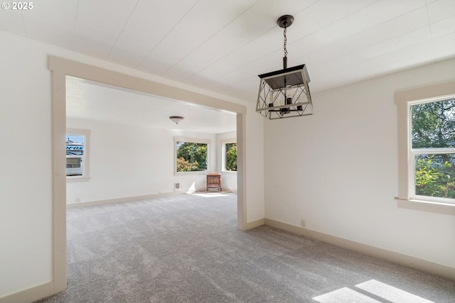 512 Evergreen Dr, Tillamook, OR 97141 - carpeted empty room featuring a chandelier and baseboards