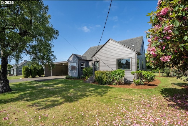 512 Evergreen Dr, Tillamook, OR 97141 - view of side of home with a yard and an attached carport