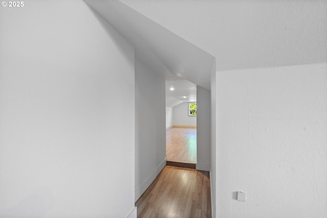 512 Evergreen Dr, Tillamook, OR 97141 - hallway with vaulted ceiling, wood finished floors, and baseboards
