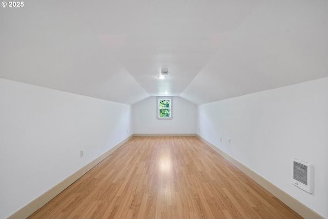 512 Evergreen Dr, Tillamook, OR 97141 - bonus room featuring heating unit, lofted ceiling, light wood finished floors, and baseboards