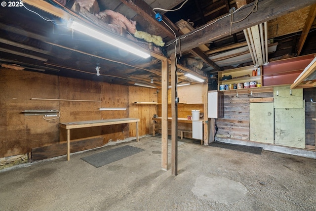 512 Evergreen Dr, Tillamook, OR 97141 - unfinished below grade area with a workshop area