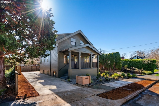 3660 SE Henderson St, Portland, OR 97202 - bungalow with a porch, driveway, and fence