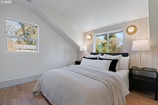 3660 SE Henderson St, Portland, OR 97202 - bedroom featuring wood finished floors and vaulted ceiling