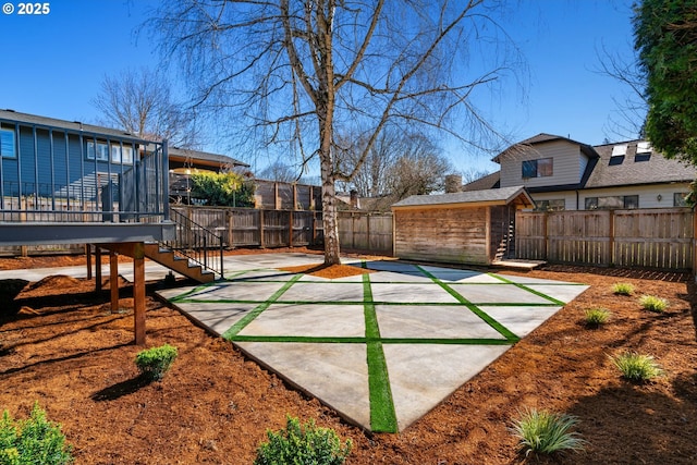 3660 SE Henderson St, Portland, OR 97202 - view of yard with a patio, an outdoor structure, stairway, a fenced backyard, and a storage unit