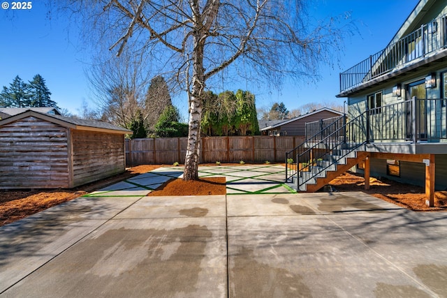 3660 SE Henderson St, Portland, OR 97202 - view of patio / terrace featuring an outbuilding, fence, and stairway