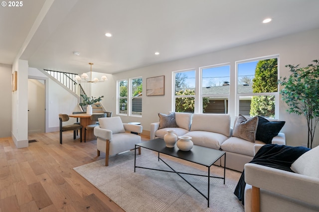 3660 SE Henderson St, Portland, OR 97202 - living area featuring recessed lighting, light wood finished floors, baseboards, and an inviting chandelier