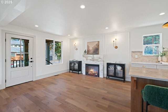 3660 SE Henderson St, Portland, OR 97202 - living area featuring light wood finished floors, recessed lighting, and a fireplace