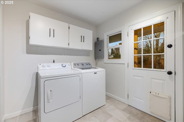 laundry room with baseboards, washer and clothes dryer, cabinet space, and electric panel