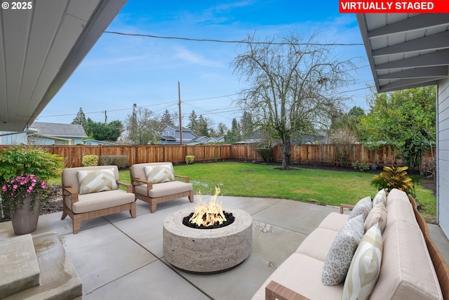 view of patio / terrace featuring an outdoor living space with a fire pit and a fenced backyard