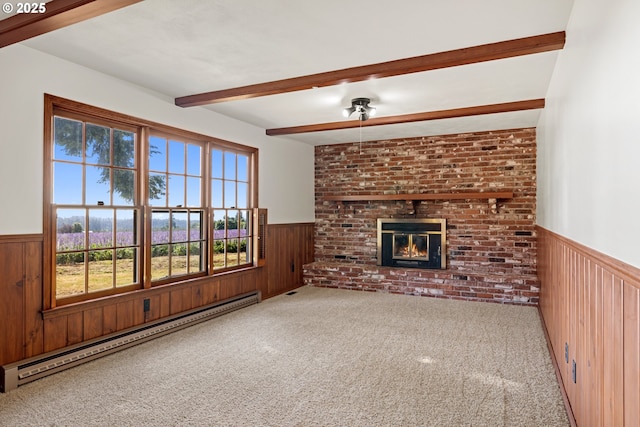 17753 Powers Creek Loop Rd, Silverton, OR 97381 - unfurnished living room with wainscoting, a baseboard radiator, beam ceiling, wooden walls, and carpet