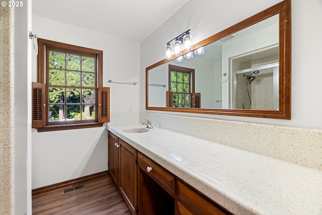 17753 Powers Creek Loop Rd, Silverton, OR 97381 - full bathroom featuring plenty of natural light, wood finished floors, vanity, and an enclosed shower
