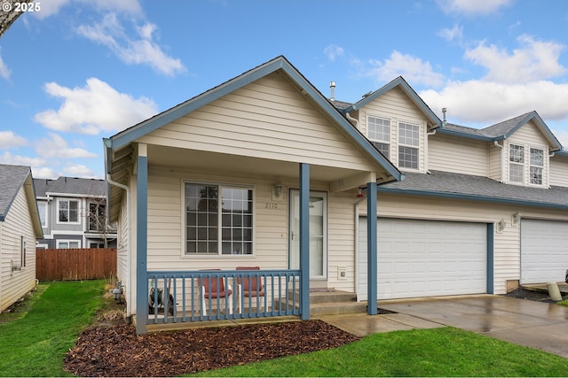 view of front of property with covered porch and a garage