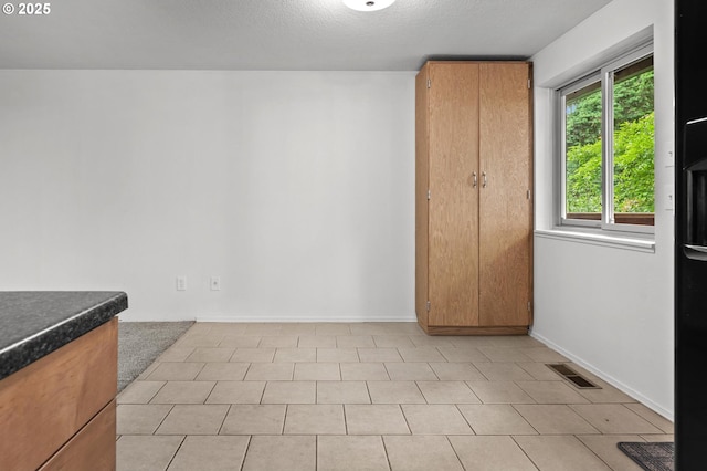 345 S 11th St, Saint Helens, OR 97051 - empty room featuring baseboards and a textured ceiling