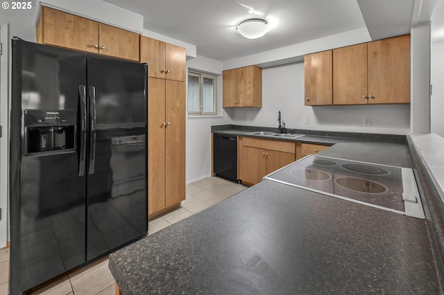 345 S 11th St, Saint Helens, OR 97051 - kitchen featuring black appliances, a sink, dark countertops, light tile patterned floors, and brown cabinets