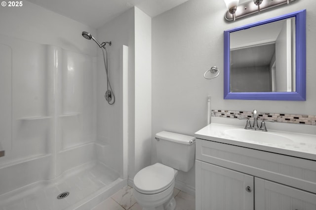 345 S 11th St, Saint Helens, OR 97051 - full bath featuring vanity, toilet, a shower, backsplash, and baseboards