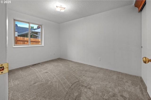 345 S 11th St, Saint Helens, OR 97051 - spare room with carpet and a textured ceiling
